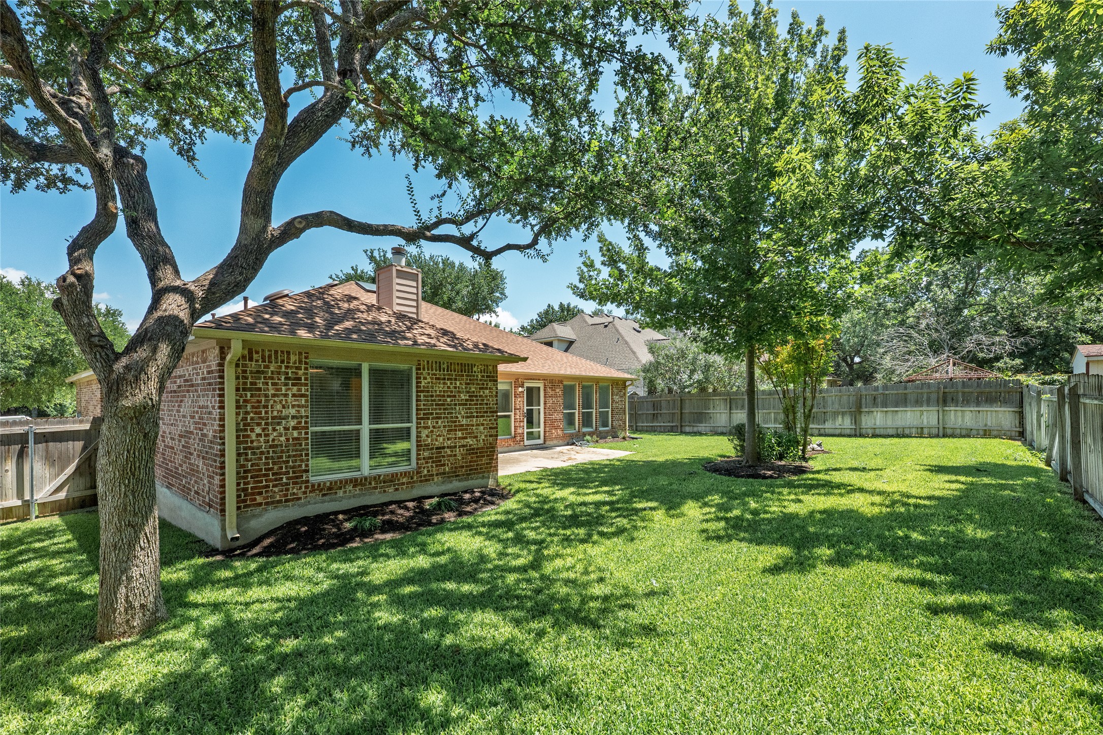 111 Arrowhead Lane Georgetown, TX 78628 - Photo 37 of 40 a view of a house with a yard