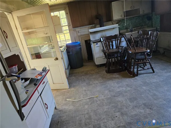 a view of work space with furniture and window
