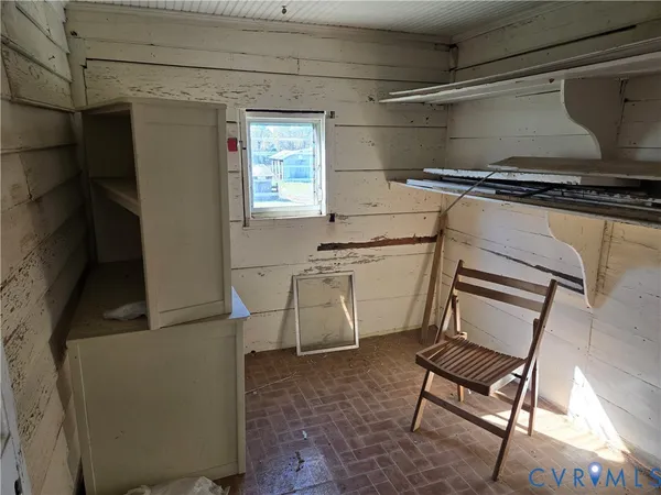 a utility room with cabinets dryer and washer
