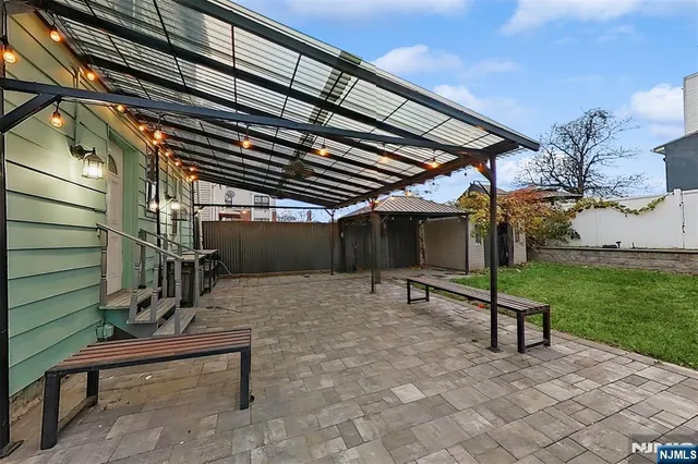 a view of a backyard with a bench