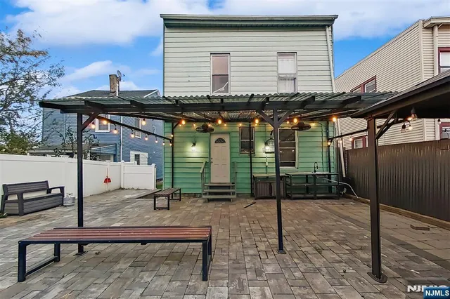 a front view of a house with parking area