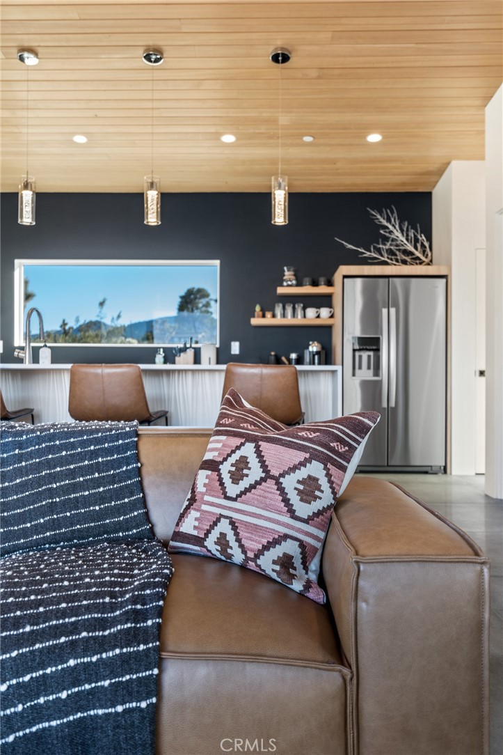 6737 Saddleback Road Joshua Tree, CA 92252 - Photo 17 of 65 a kitchen with a stove and a refrigerator