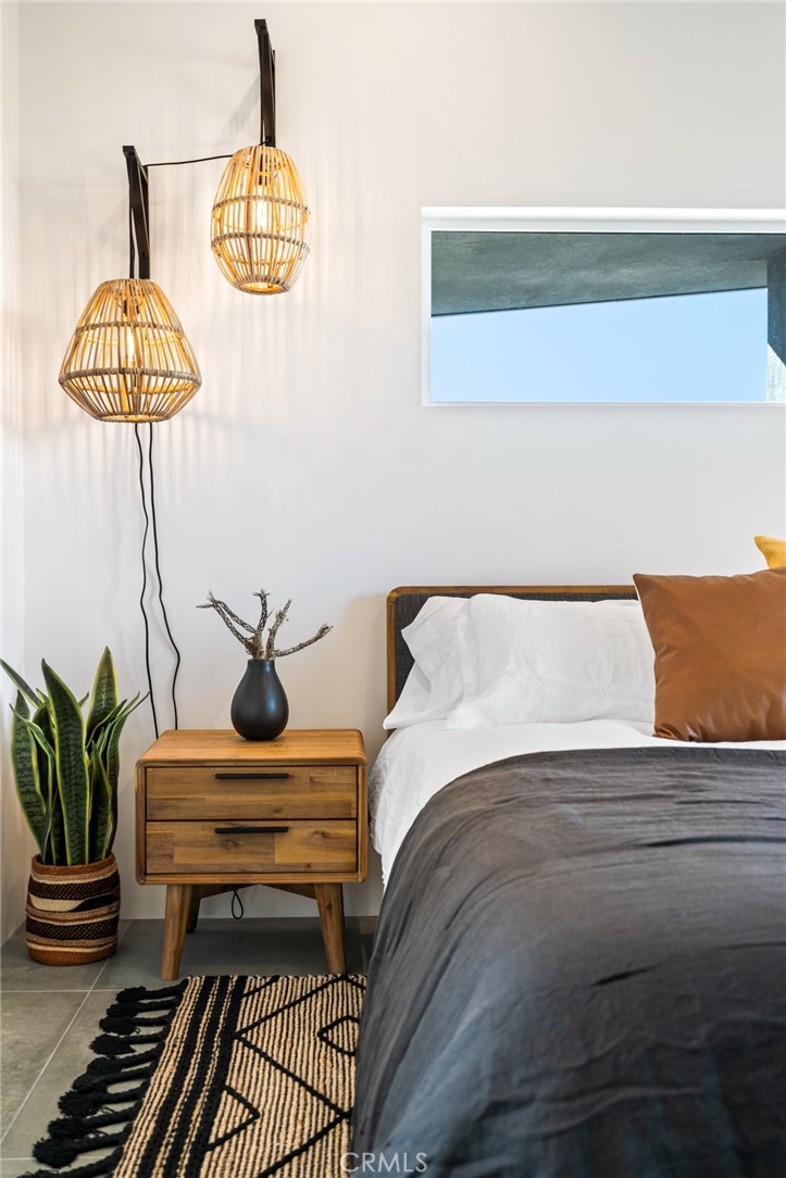 6737 Saddleback Road Joshua Tree, CA 92252 - Photo 20 of 65 a bedroom with a bed and ceiling fan