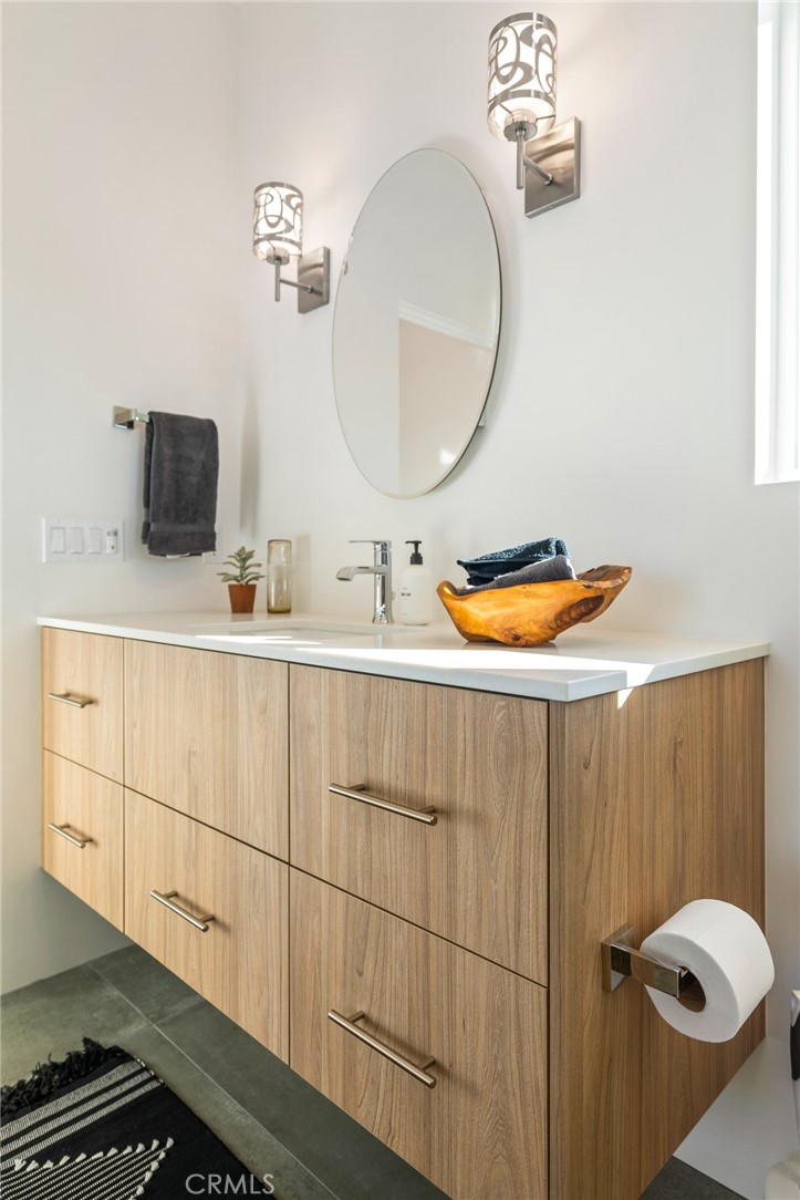6737 Saddleback Road Joshua Tree, CA 92252 - Photo 27 of 65 a bathroom with a sink and a mirror