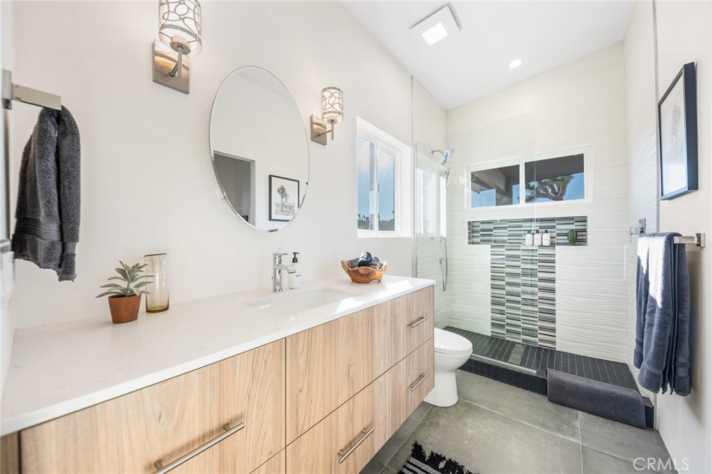 6737 Saddleback Road Joshua Tree, CA 92252 - Photo 33 of 65 a bathroom with a sink toilet and shower
