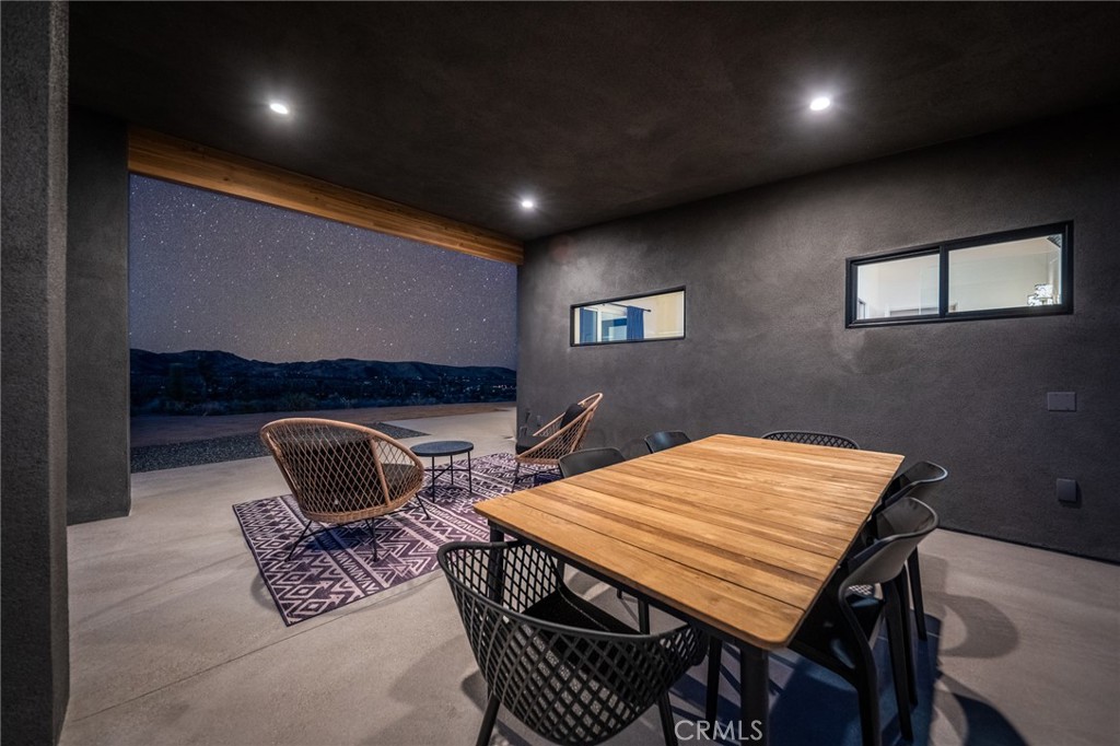 6737 Saddleback Road Joshua Tree, CA 92252 - Photo 35 of 65 a outdoor space with a table and chairs