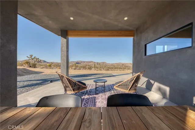 a living room with furniture pool table and a fireplace