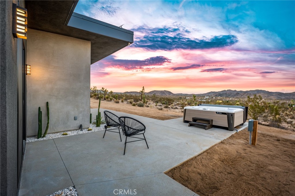 6737 Saddleback Road Joshua Tree, CA 92252 - Photo 50 of 65 a view of a terrace with couches and a potted plant