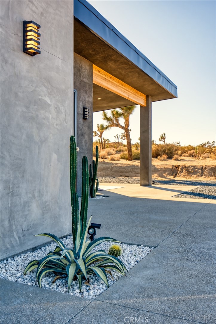 6737 Saddleback Road Joshua Tree, CA 92252 - Photo 51 of 65 a view of a room with floor to ceiling windows and wooden floor