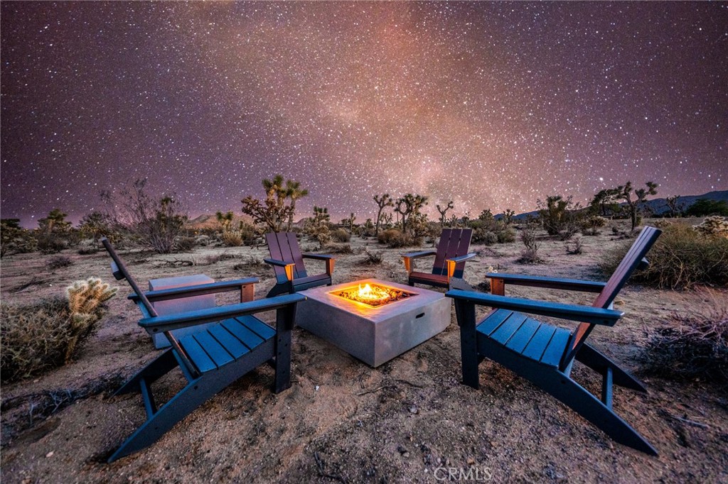 6737 Saddleback Road Joshua Tree, CA 92252 - Photo 61 of 65 a view of a chairs in a patio