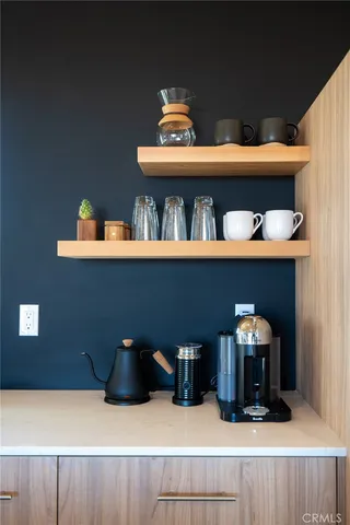 a reading room with furniture and a rug