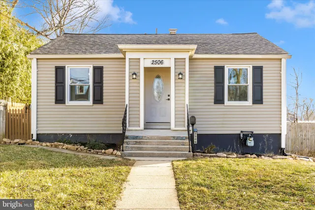 a view of a house with snow on the road