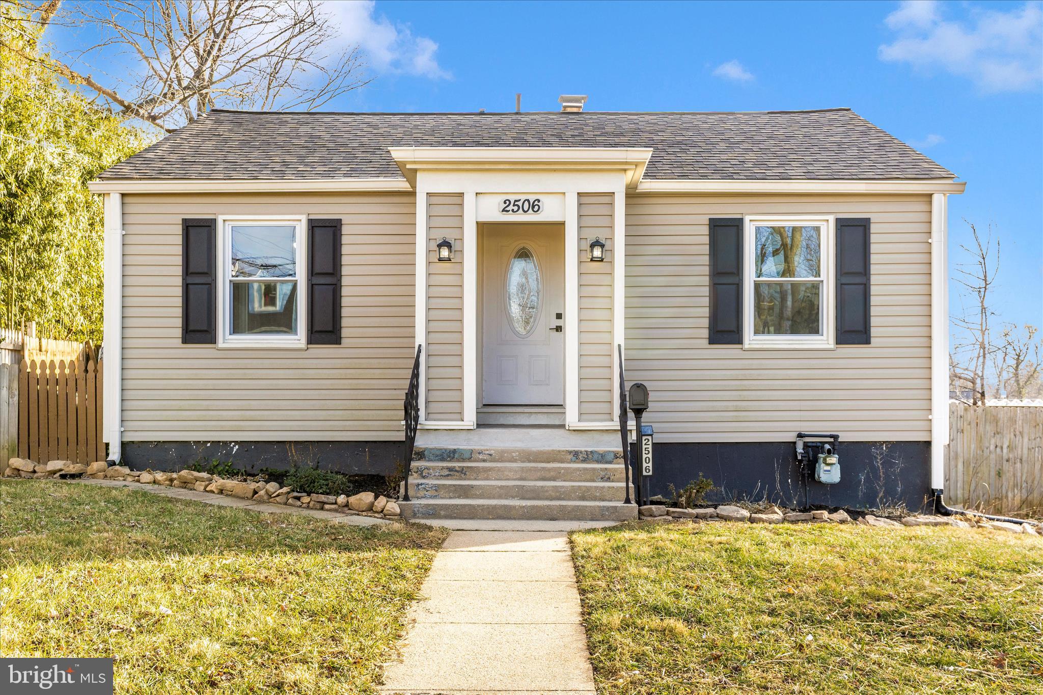 a view of a house with snow on the road