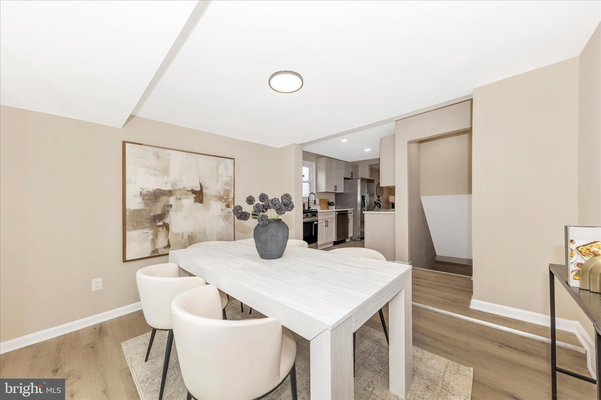 2506 Lindell Street Silver Spring, MD 20902 - Photo 12 of 47 a view of a dining room with furniture and wooden floor