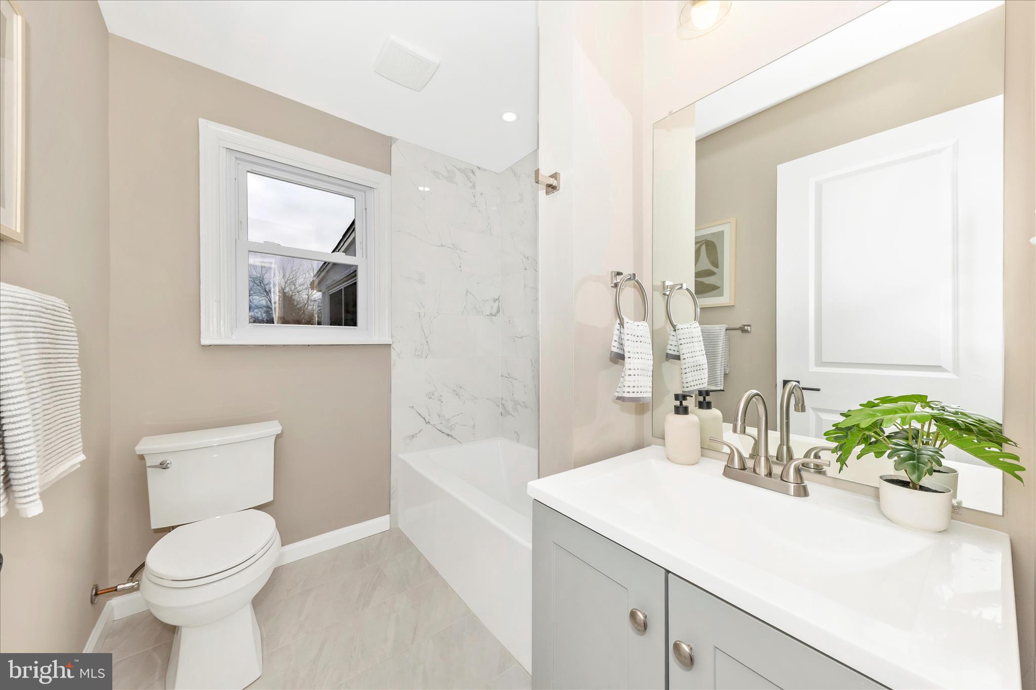 2506 Lindell Street Silver Spring, MD 20902 - Photo 13 of 47 a bathroom with a sink a toilet and shower