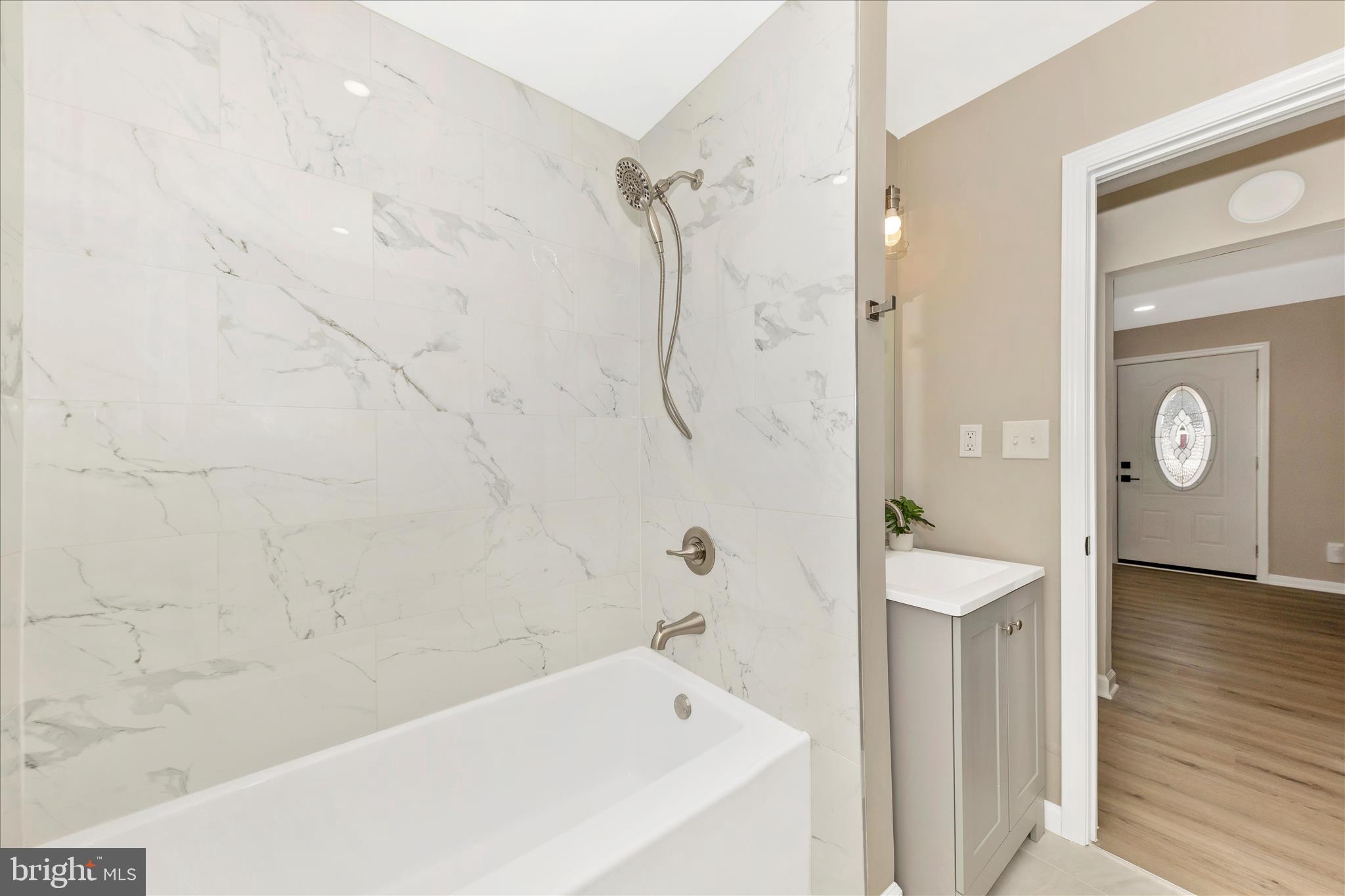 2506 Lindell Street Silver Spring, MD 20902 - Photo 14 of 47 a bathroom with a bathtub and a shower