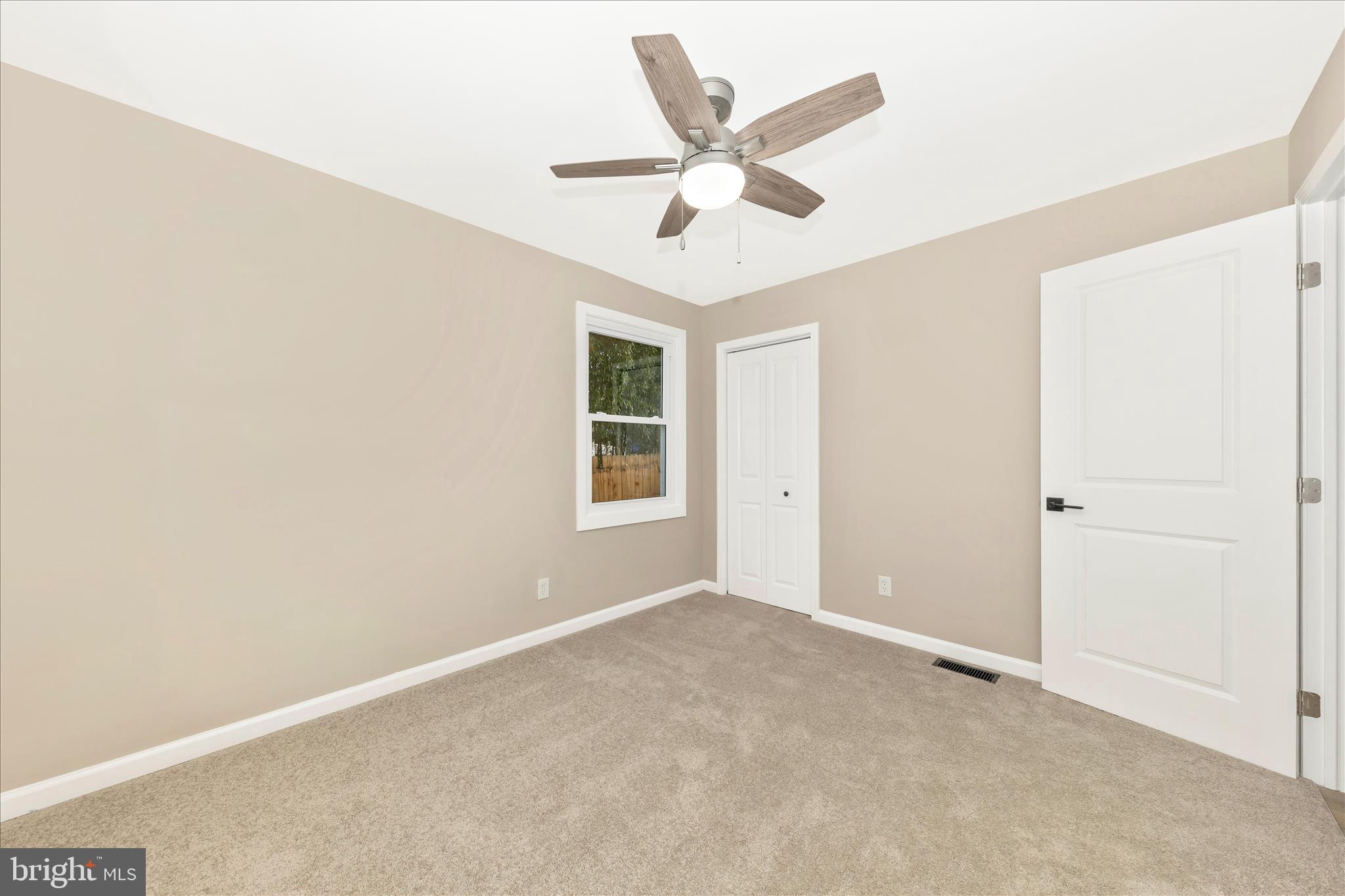 2506 Lindell Street Silver Spring, MD 20902 - Photo 18 of 47 an empty room with ceiling fan and window