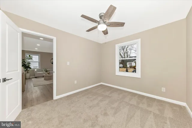wooden floor in an empty room and a window