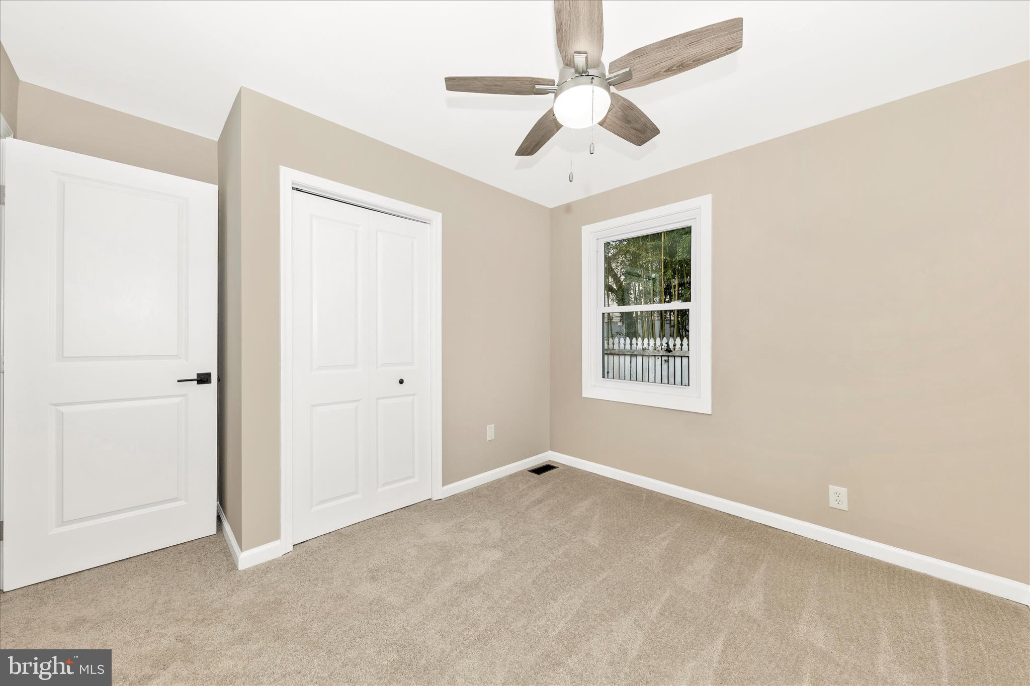 2506 Lindell Street Silver Spring, MD 20902 - Photo 22 of 47 an empty room with ceiling fan and window