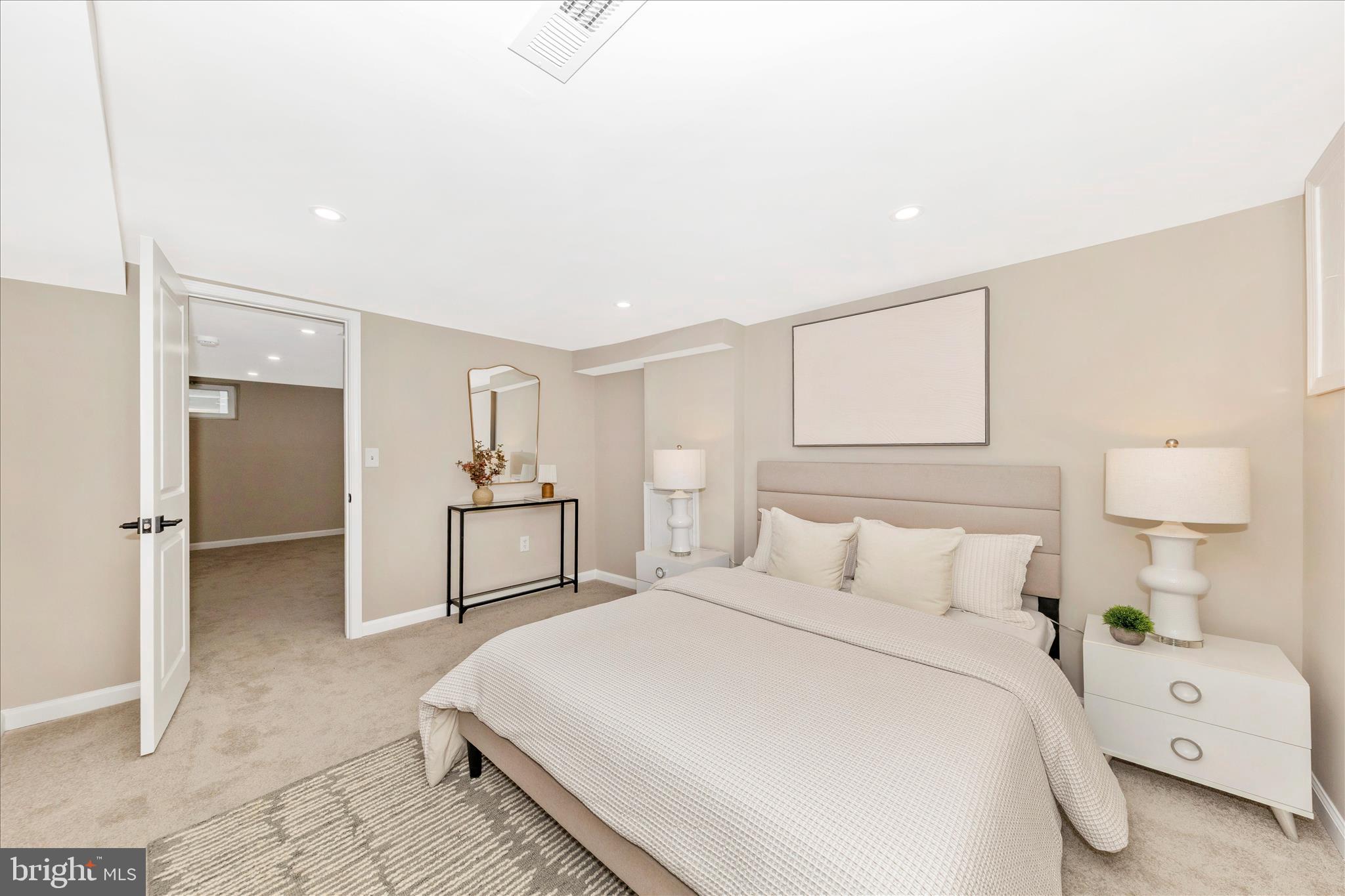 2506 Lindell Street Silver Spring, MD 20902 - Photo 31 of 47 a bedroom with a bed and a refrigerator