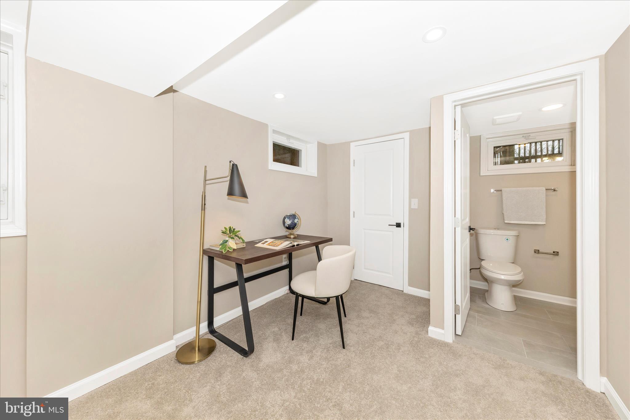2506 Lindell Street Silver Spring, MD 20902 - Photo 32 of 47 a living room with furniture and a toilet