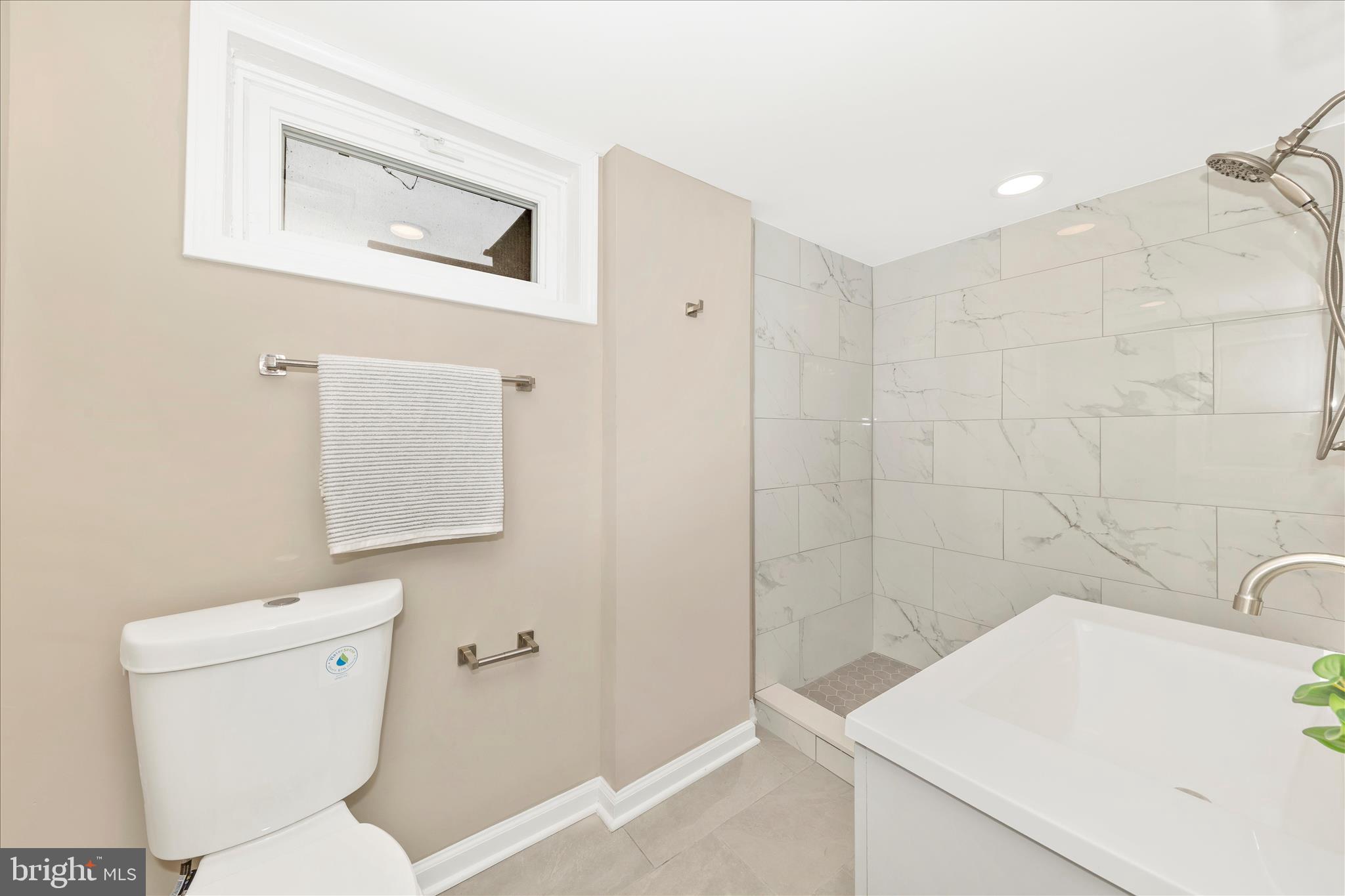 2506 Lindell Street Silver Spring, MD 20902 - Photo 33 of 47 a bathroom with a sink a toilet and shower