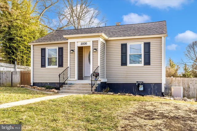 a view of a house with snow on the road