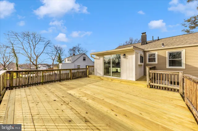 a view of a house with wooden fence