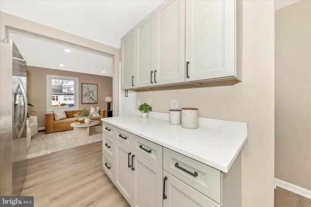 a kitchen with cabinets and window