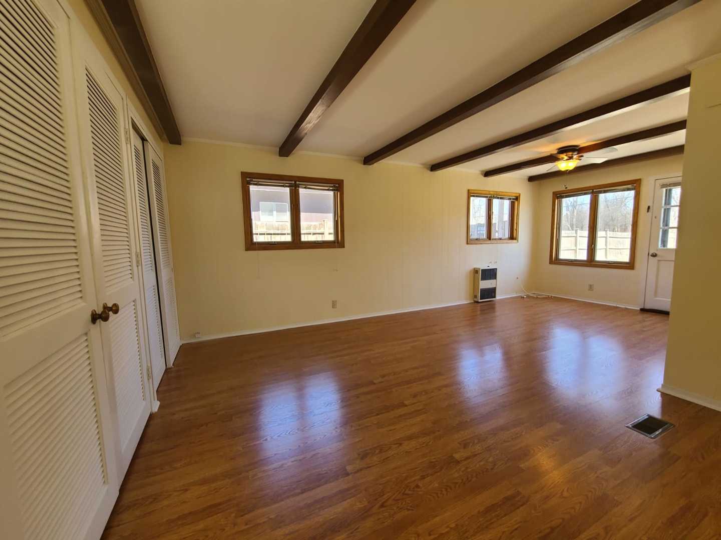 1441 Maple Street Glenview, IL 60025 - Photo 18 of 22 a view of an empty room with wooden floor and a window