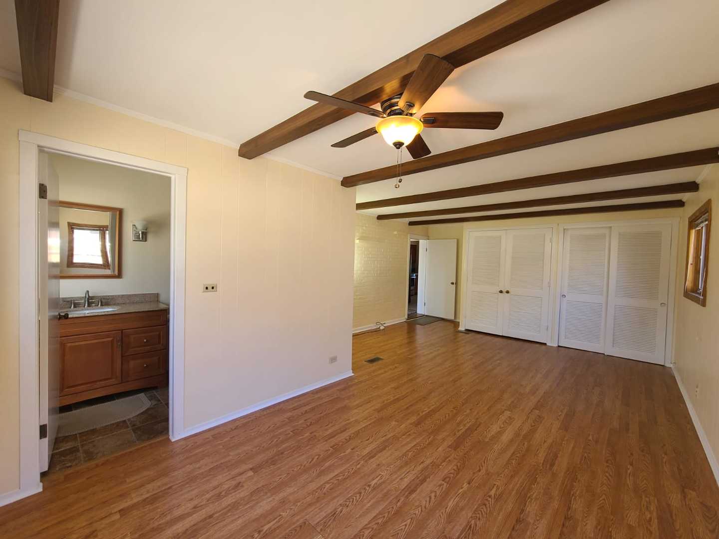 1441 Maple Street Glenview, IL 60025 - Photo 20 of 22 an empty room with wooden floor cabinet and windows