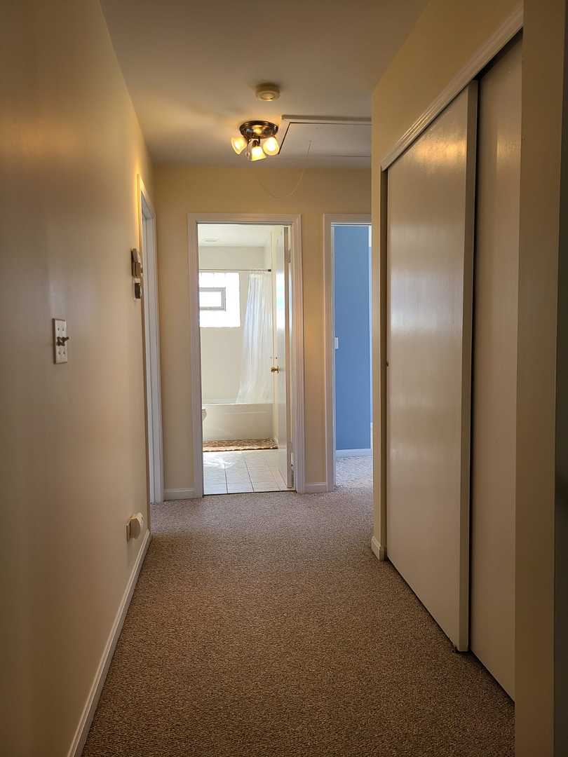 1441 Maple Street Glenview, IL 60025 - Photo 22 of 22 a view of a room with a wardrobe space