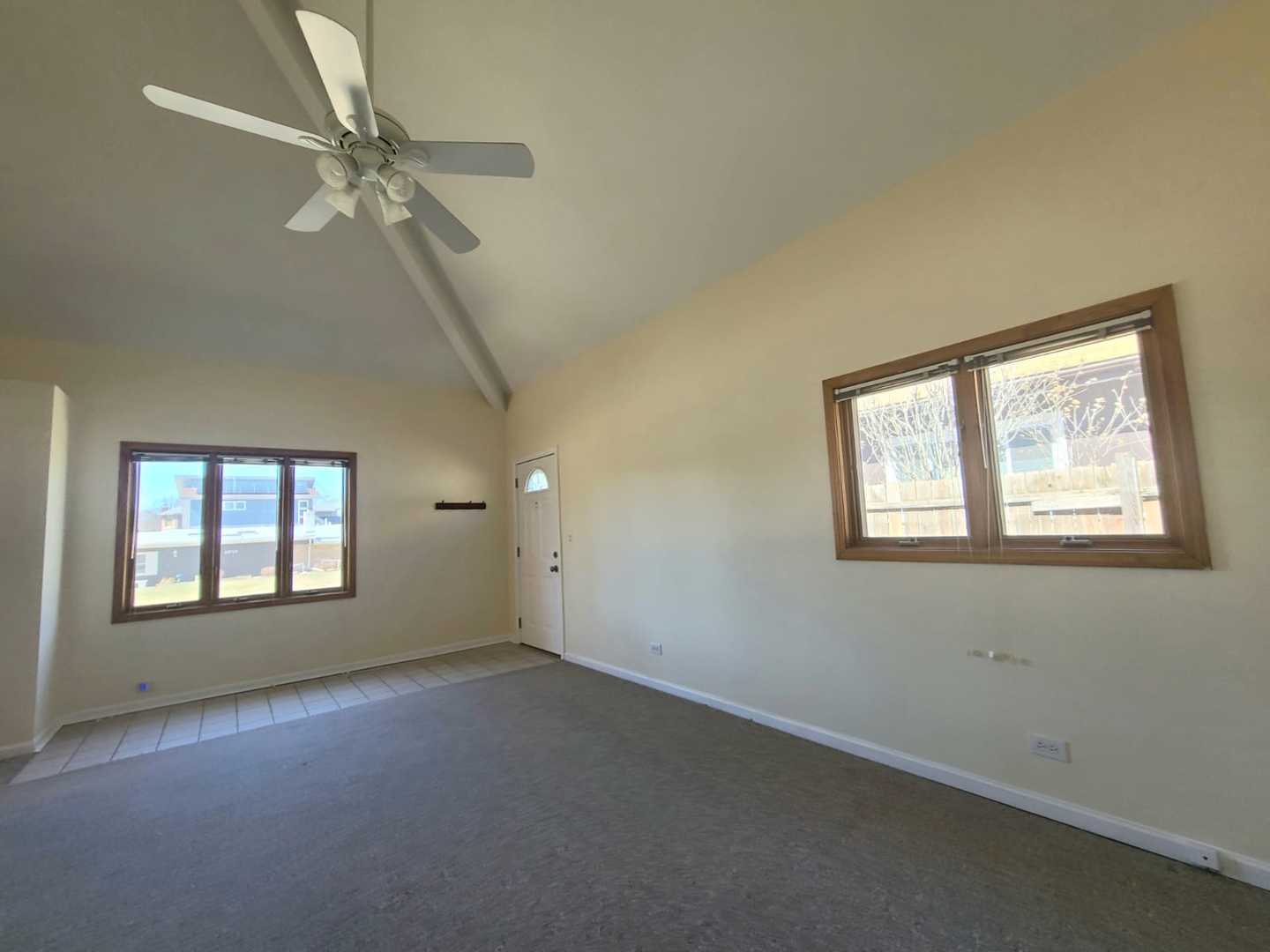 1441 Maple Street Glenview, IL 60025 - Photo 4 of 22 an empty room with windows and fan