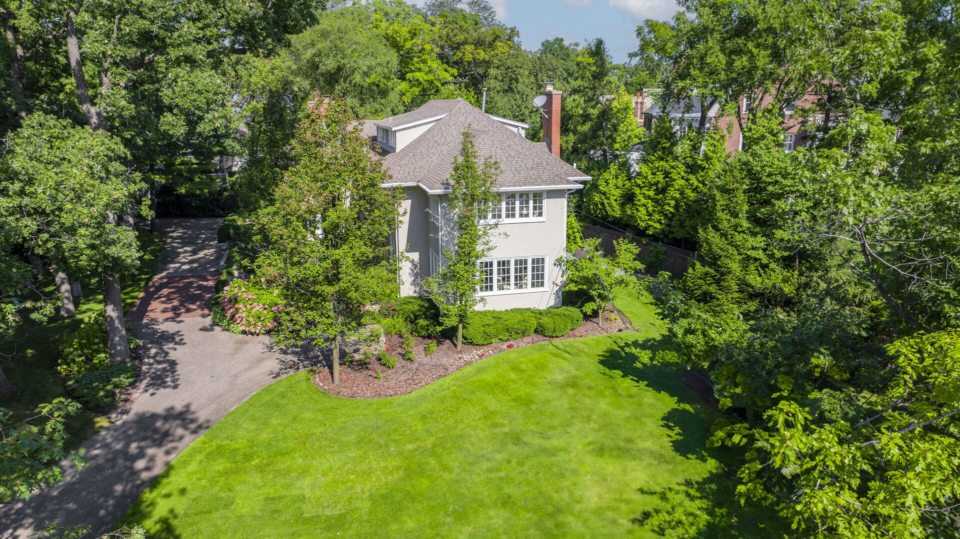 646 Prospect Avenue Winnetka, IL 60093 - Photo 15 of 22 a view of a house with a yard and garden