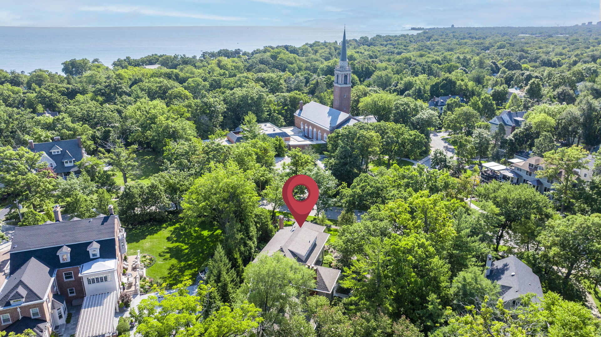 646 Prospect Avenue Winnetka, IL 60093 - Photo 16 of 22 an aerial view of a house with a yard and lake view