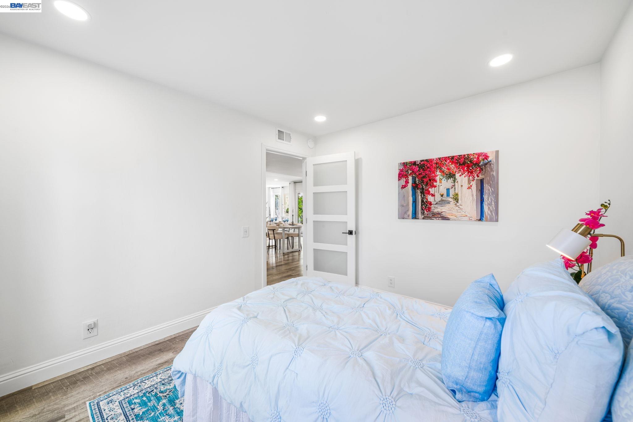 4019 Rennellwood Way Pleasanton, CA 94566 - Photo 11 of 48 a bedroom with a bed and a painting on the wall