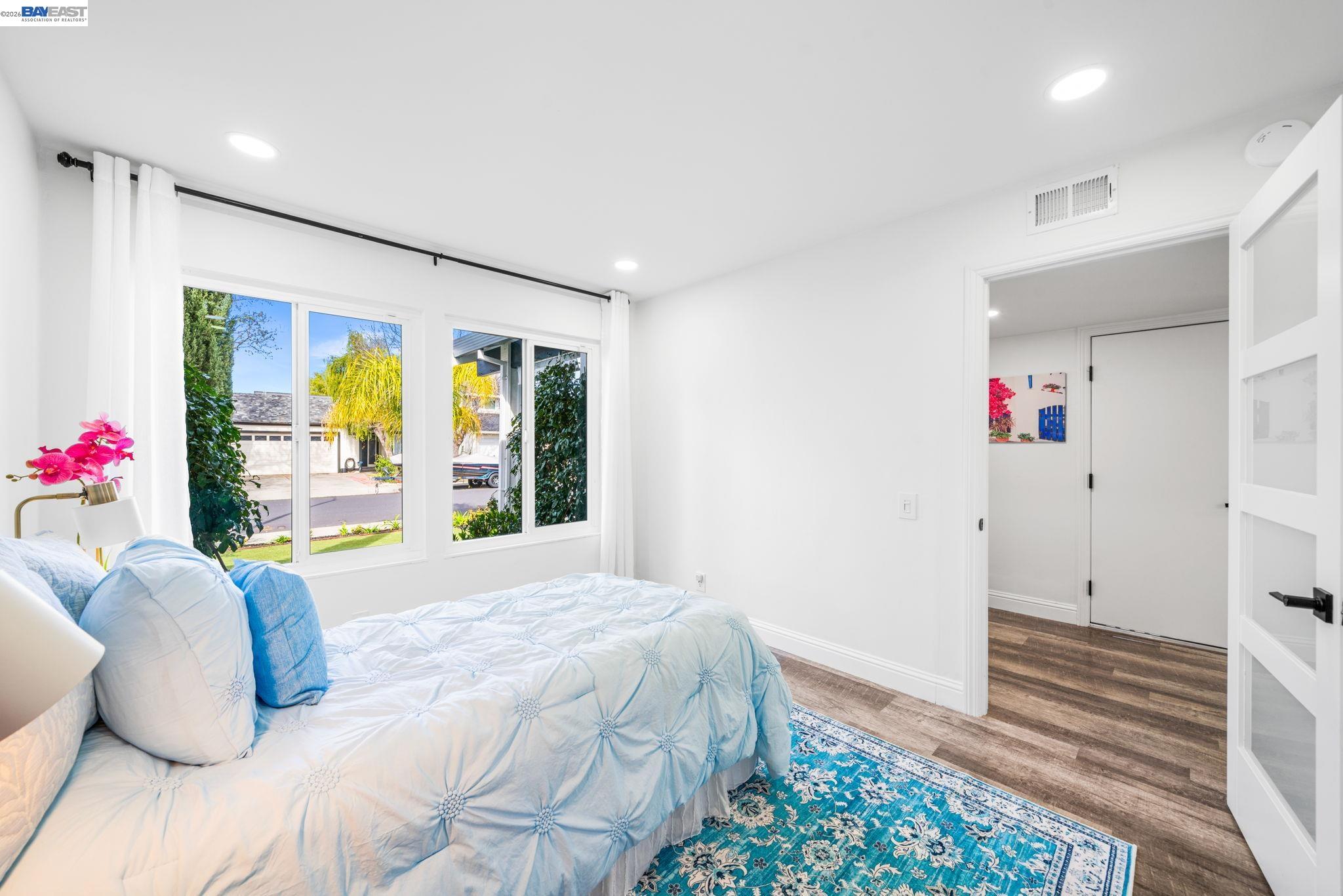 4019 Rennellwood Way Pleasanton, CA 94566 - Photo 12 of 48 a bedroom with a bed and a large window