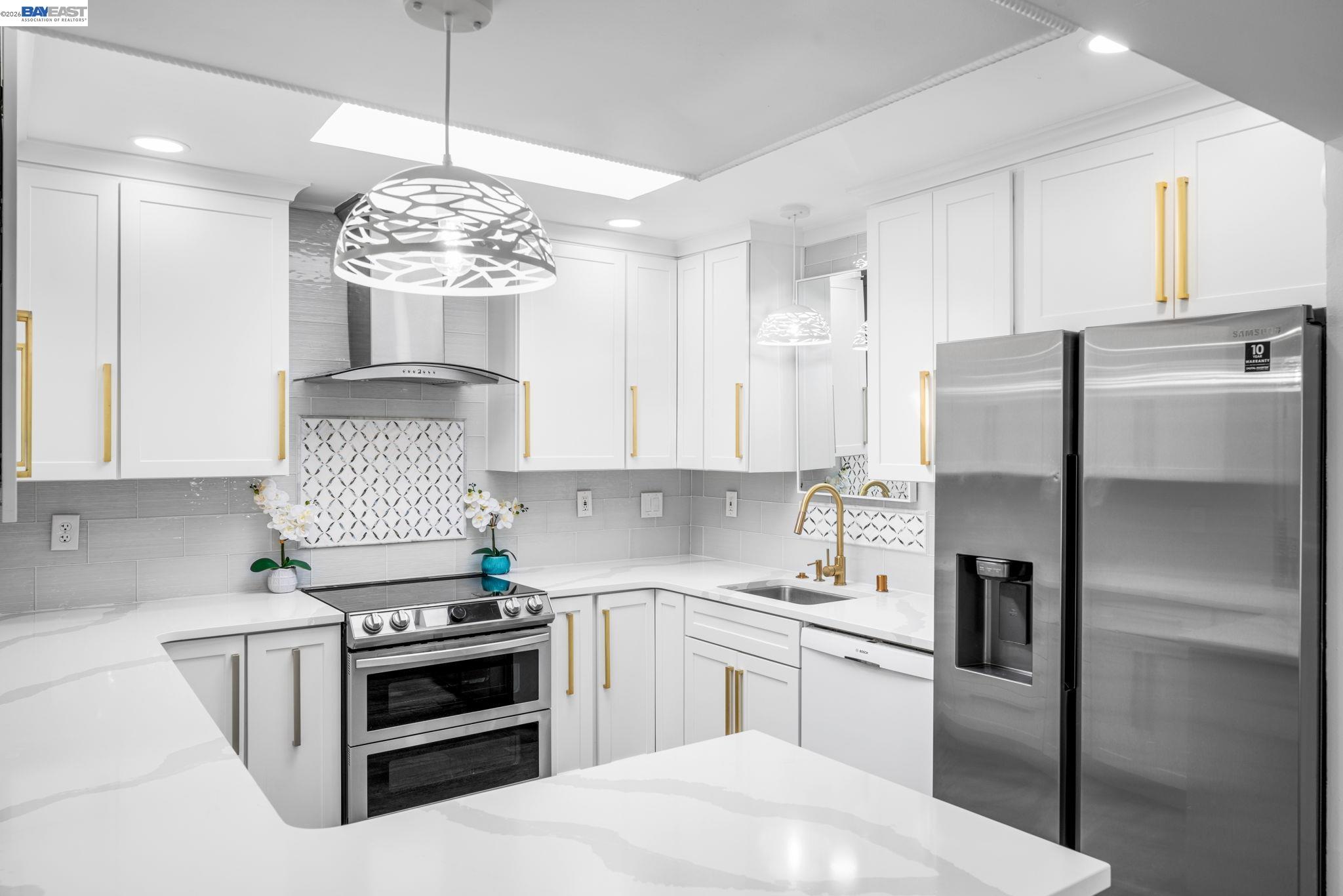 4019 Rennellwood Way Pleasanton, CA 94566 - Photo 14 of 48 a kitchen with stainless steel appliances granite countertop a refrigerator a sink dishwasher a stove and white cabinets with wooden floor