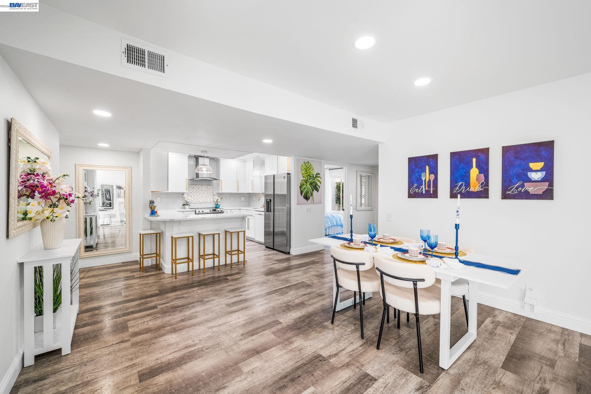4019 Rennellwood Way Pleasanton, CA 94566 - Photo 18 of 48 a view of a dining room with furniture and wooden floor