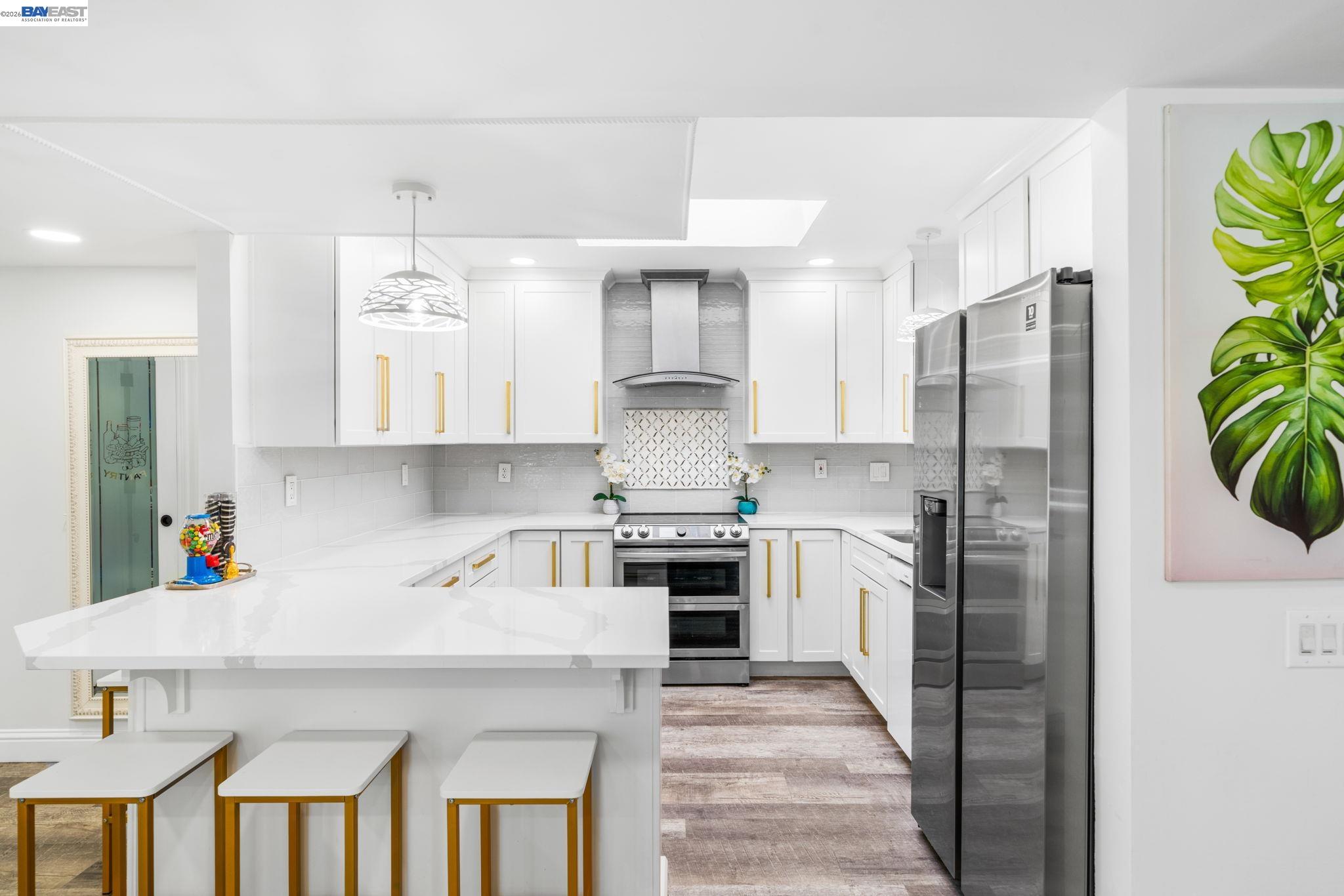 4019 Rennellwood Way Pleasanton, CA 94566 - Photo 2 of 48 a kitchen with cabinets and stainless steel appliances