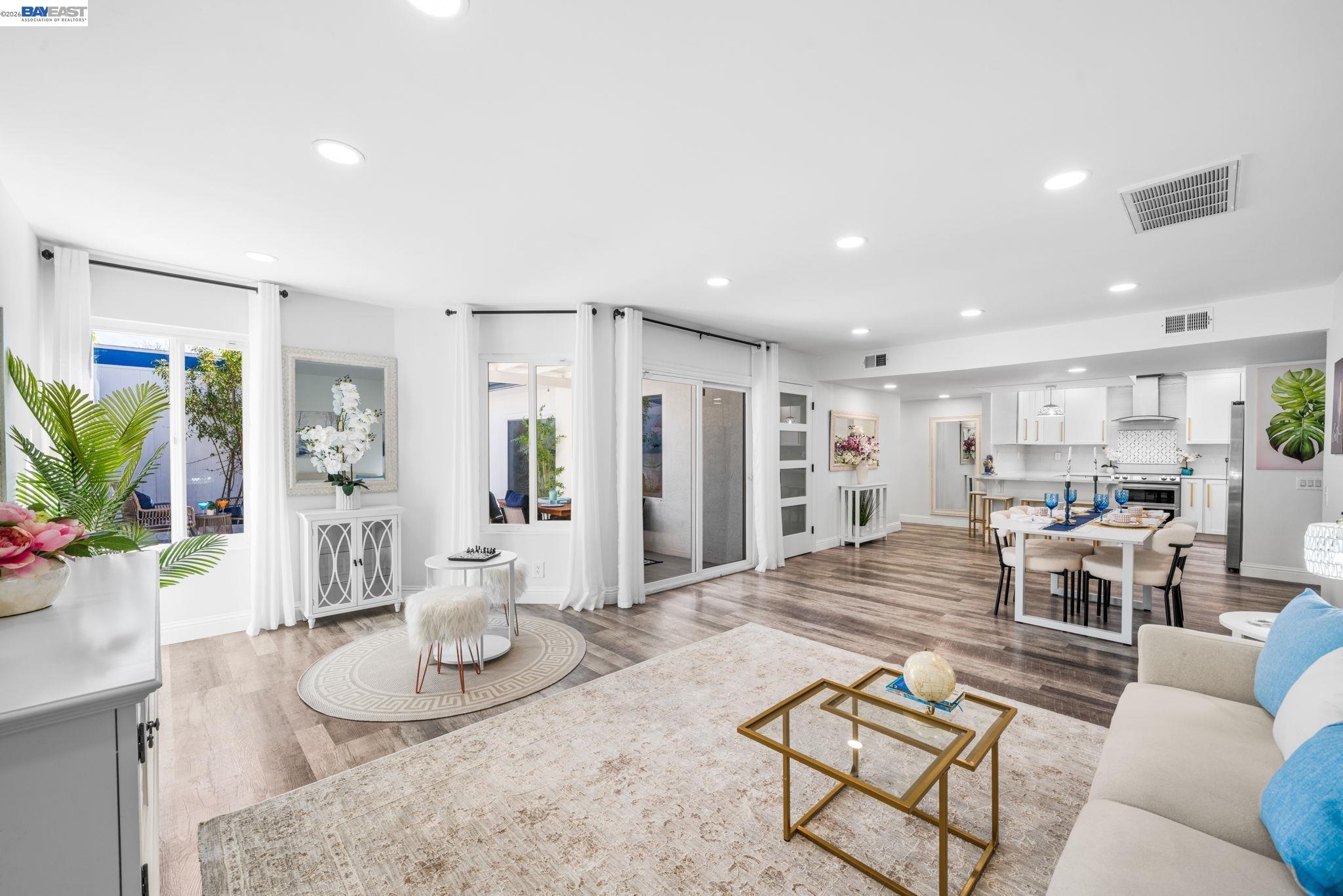 4019 Rennellwood Way Pleasanton, CA 94566 - Photo 25 of 48 a living room with furniture and kitchen view