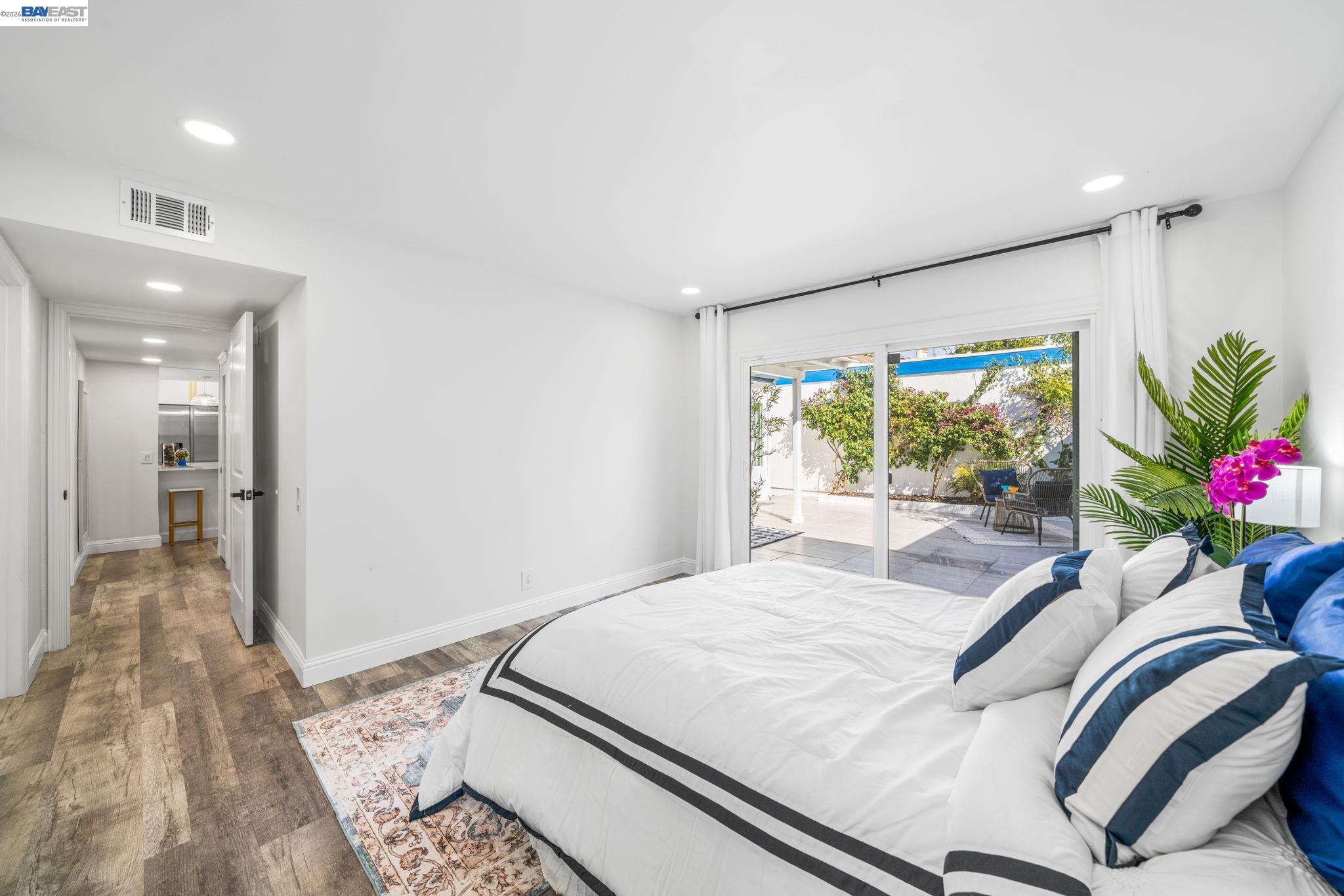 4019 Rennellwood Way Pleasanton, CA 94566 - Photo 28 of 48 a bedroom with a bed and a potted plant