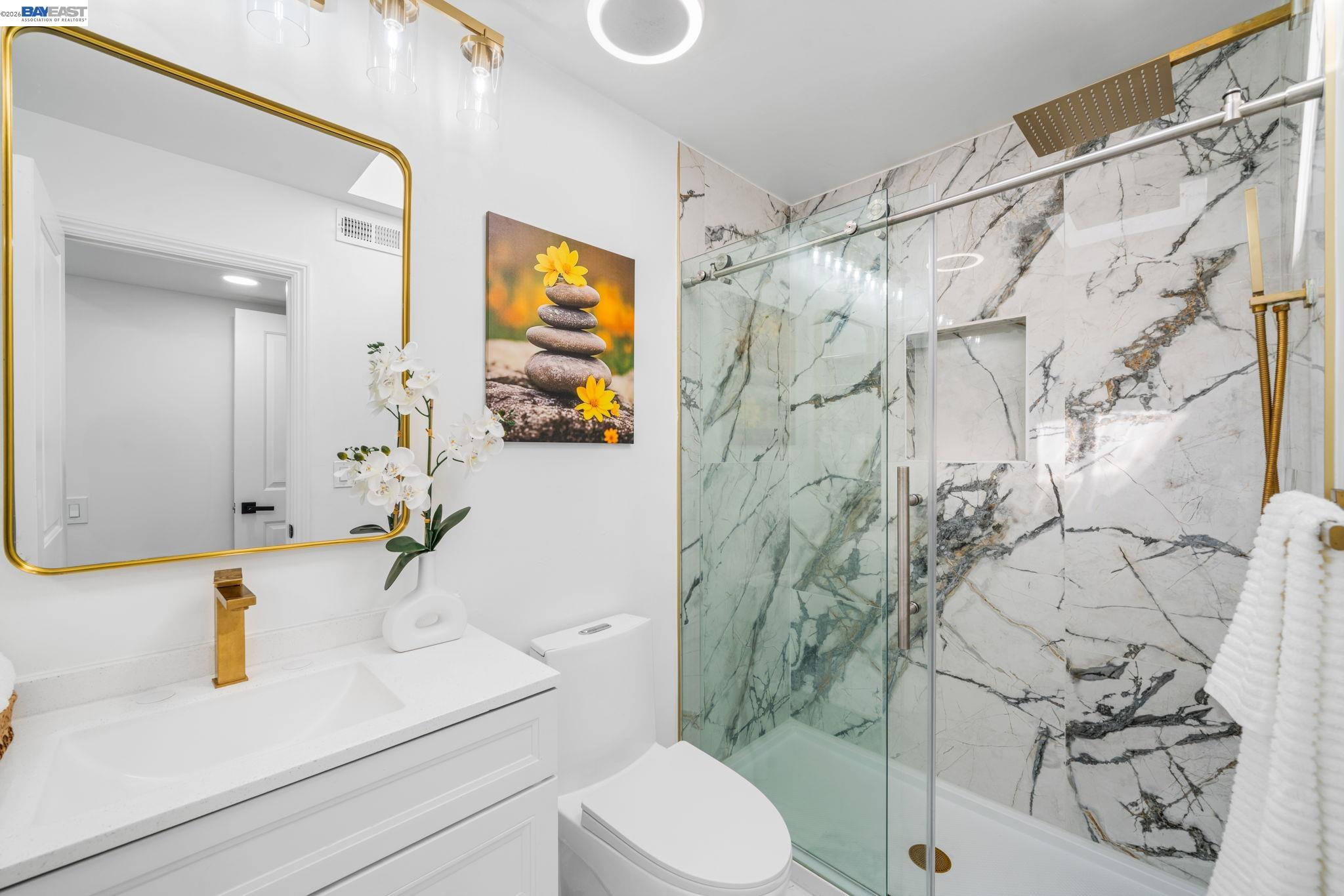 4019 Rennellwood Way Pleasanton, CA 94566 - Photo 29 of 48 a bathroom with a sink toilet and shower