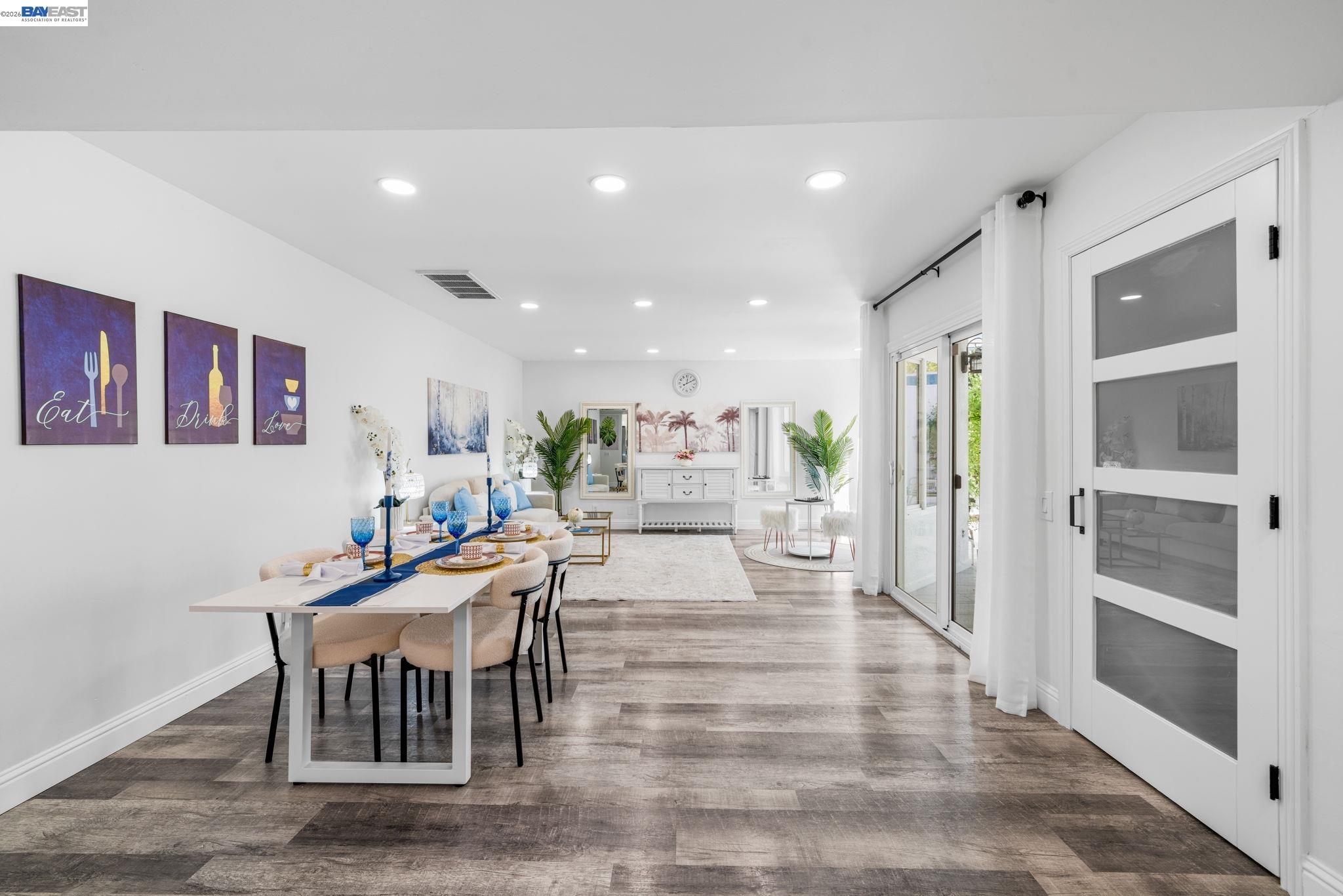 4019 Rennellwood Way Pleasanton, CA 94566 - Photo 3 of 48 a dining hall with stainless steel appliances furniture a large window and a kitchen view