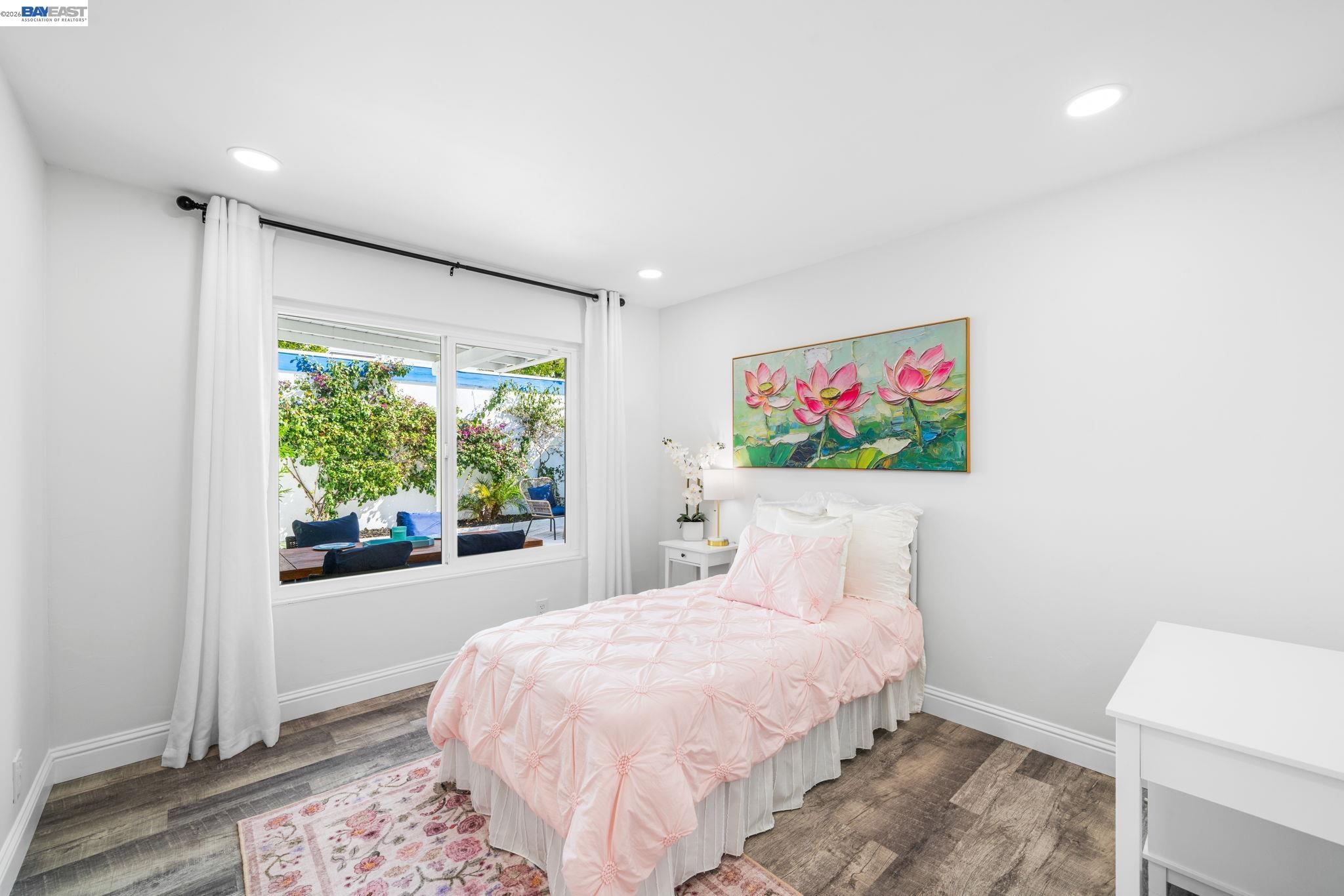 4019 Rennellwood Way Pleasanton, CA 94566 - Photo 32 of 48 a bedroom with a bed and a window