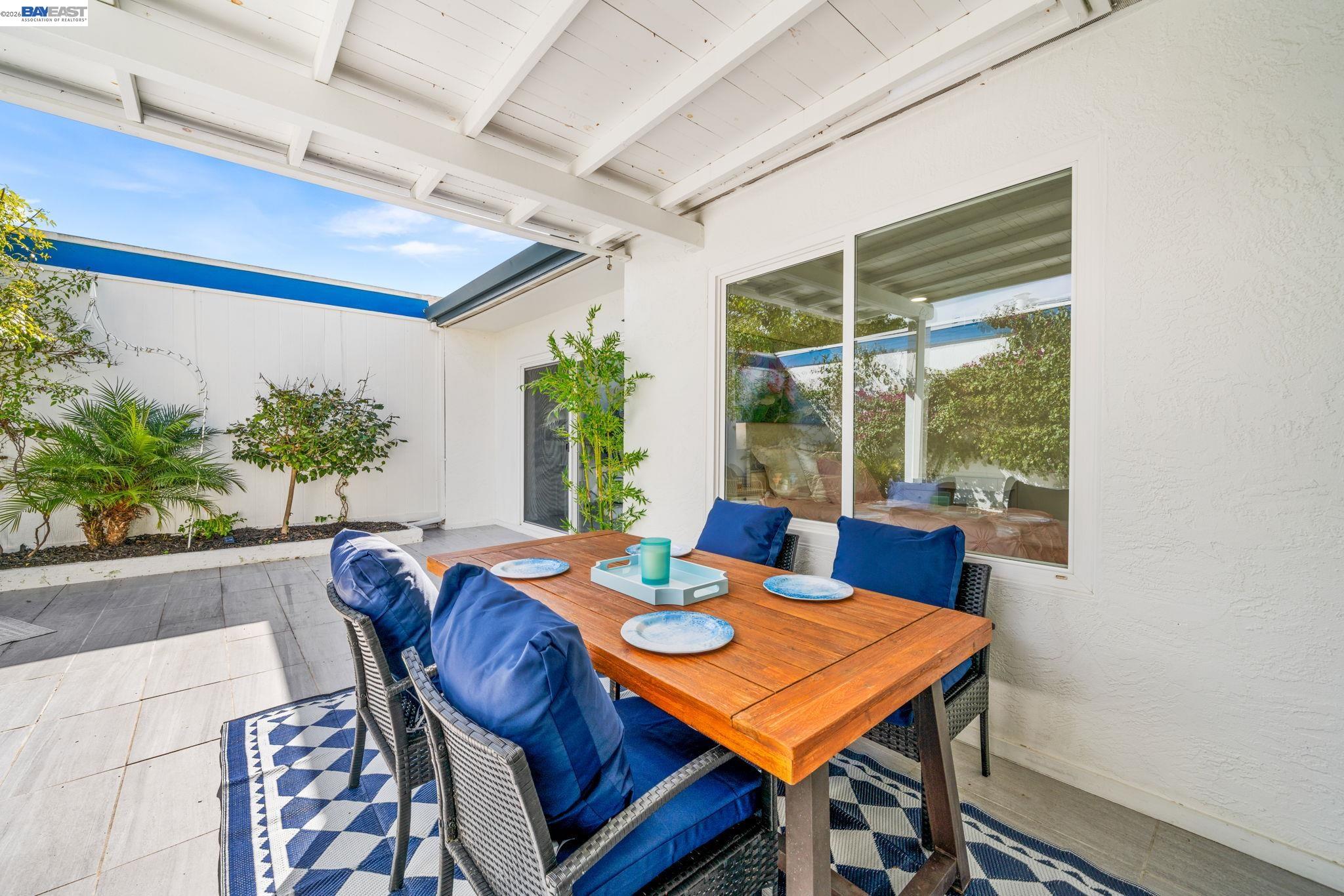 4019 Rennellwood Way Pleasanton, CA 94566 - Photo 40 of 48 a view of a dining room with furniture window and wooden floor