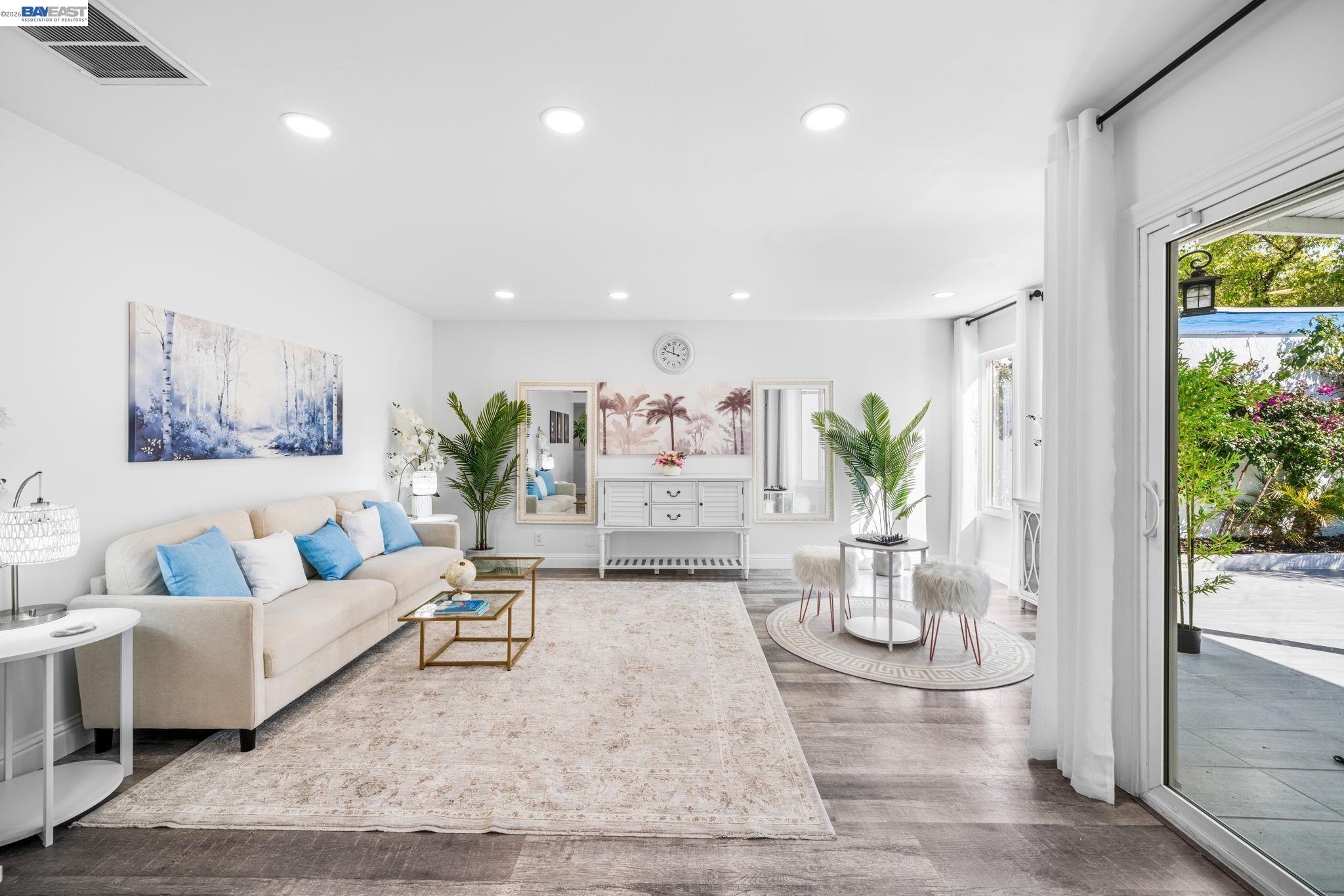 4019 Rennellwood Way Pleasanton, CA 94566 - Photo 4 of 48 a living room with furniture and a potted plant