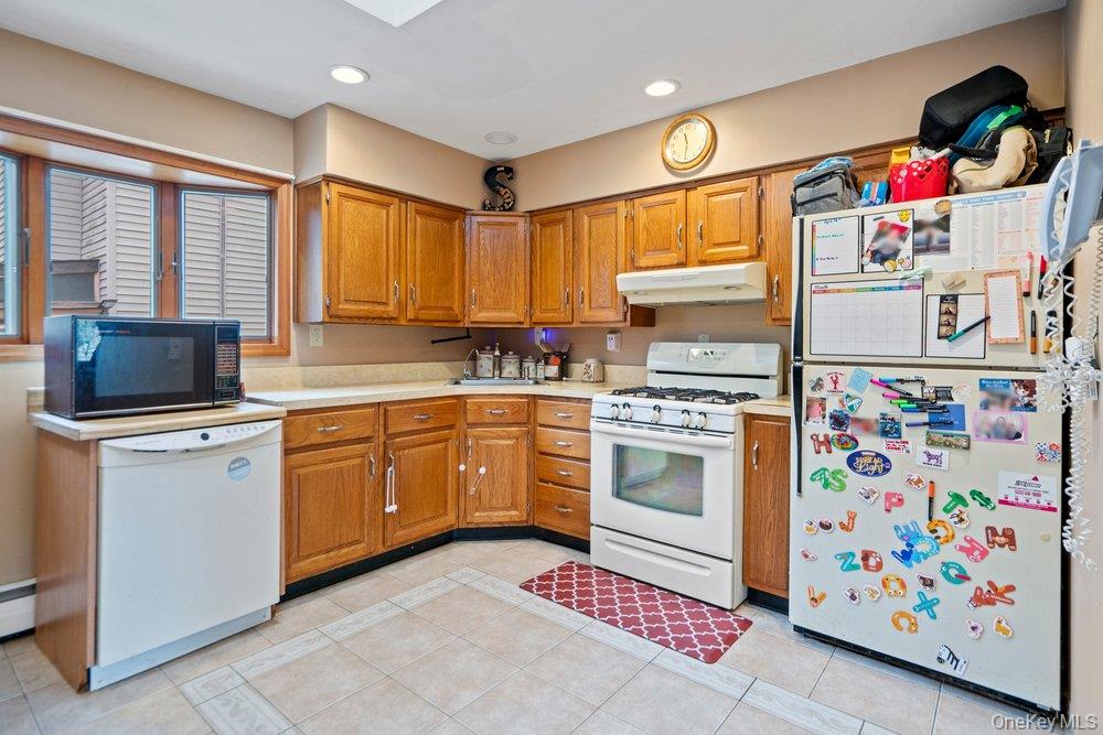 101 Sexton Road West Babylon, NY 11704 - Photo 12 of 33 a kitchen with a cabinets and window