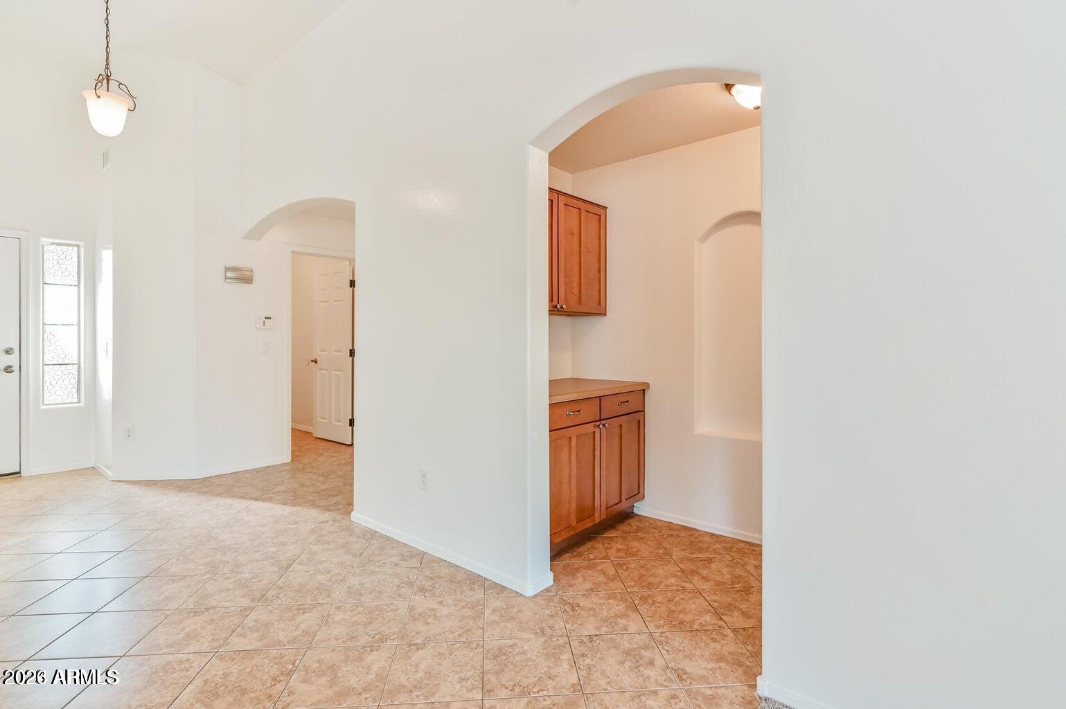 7809 South 20th Lane Phoenix, AZ 85041 - Photo 18 of 31 a view of an empty room