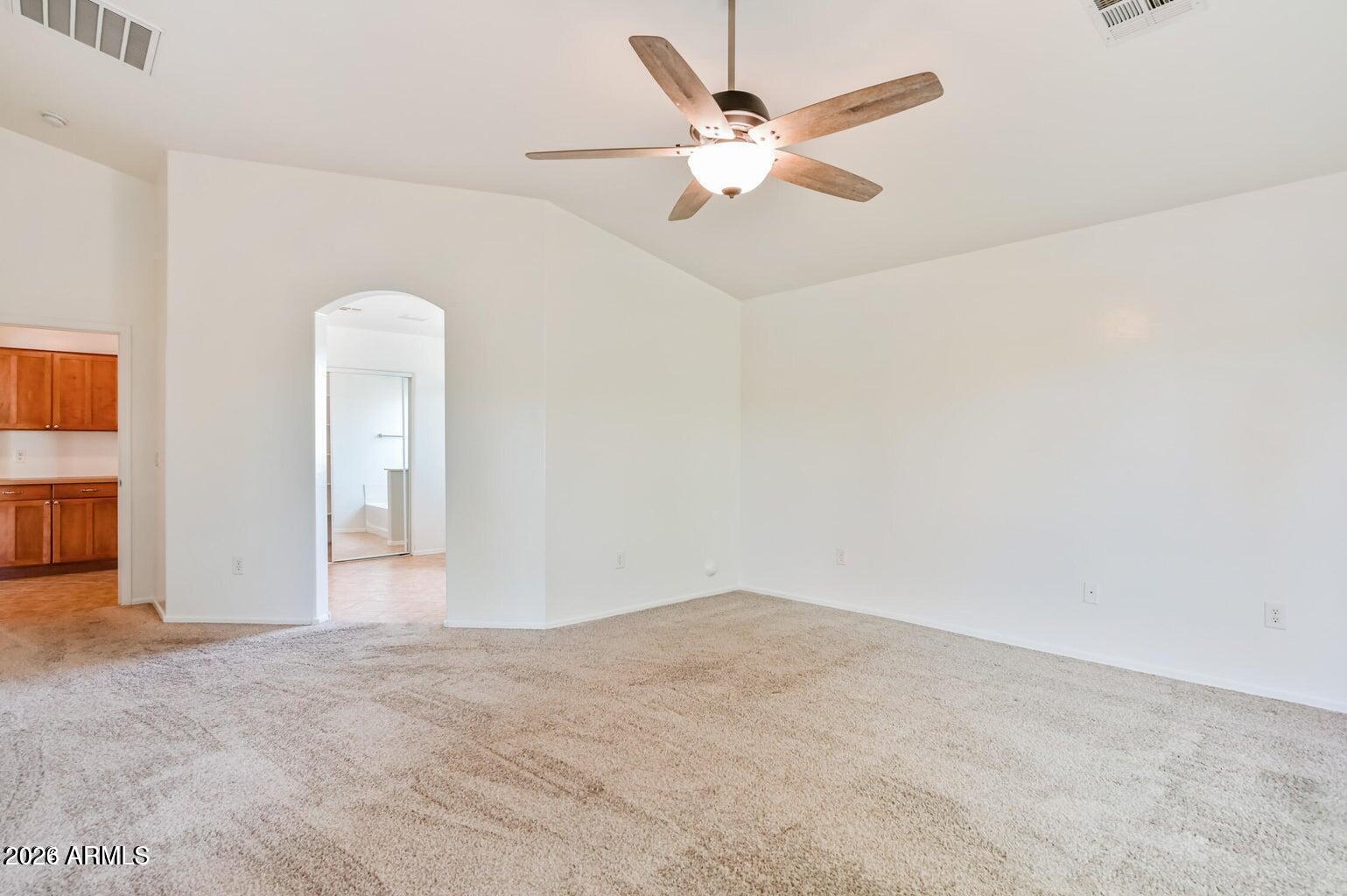 7809 South 20th Lane Phoenix, AZ 85041 - Photo 20 of 31 an empty room with closet and fan